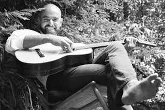 Shel Silverstein with a guitar